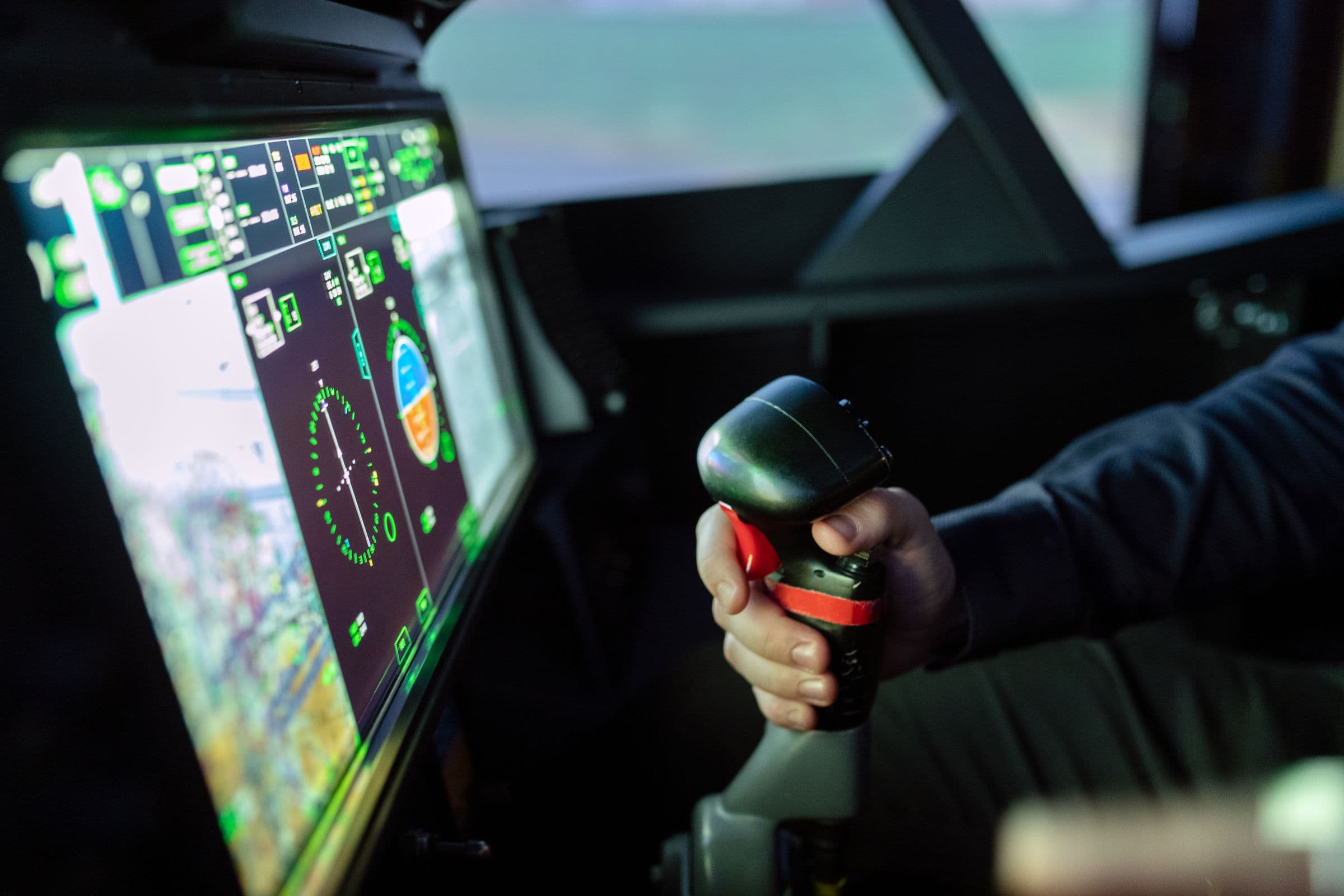 A person operating a flight simulator.