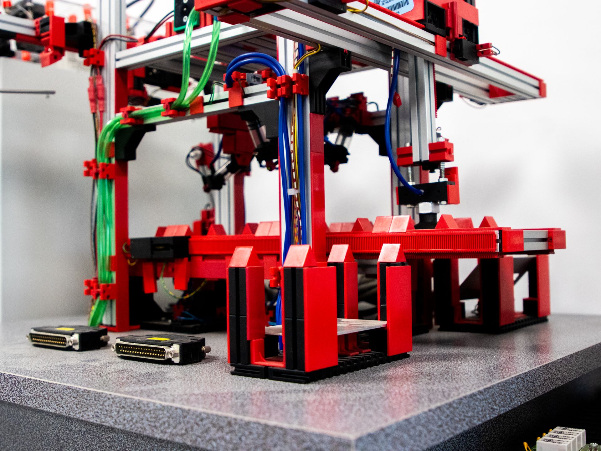 Industrial robot arms on a factory floor.